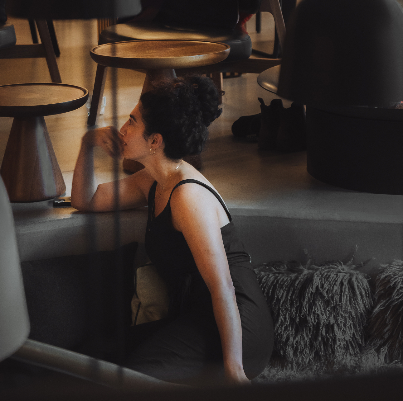 Guest relaxing in the open communal lounge area at Hotel Carina Zermatt