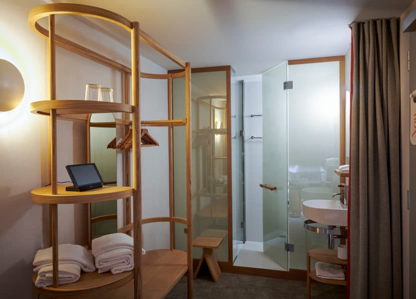 Bathroom in the Double Cocoon room with shower and modern sink at Hotel Carina Zermatt.