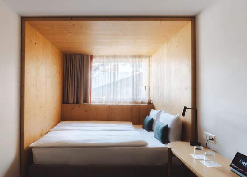 Desk and window area in the Double Cocoon room at Hotel Carina Zermatt.