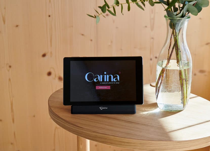 Tablet with hotel information in the Double Cocoon room at Hotel Carina Zermatt.