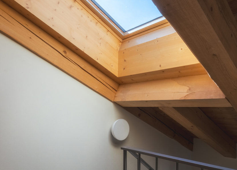 Skylight and wooden ceiling detail in the Penthouse Matterhorn at Hotel Carina Zermatt
